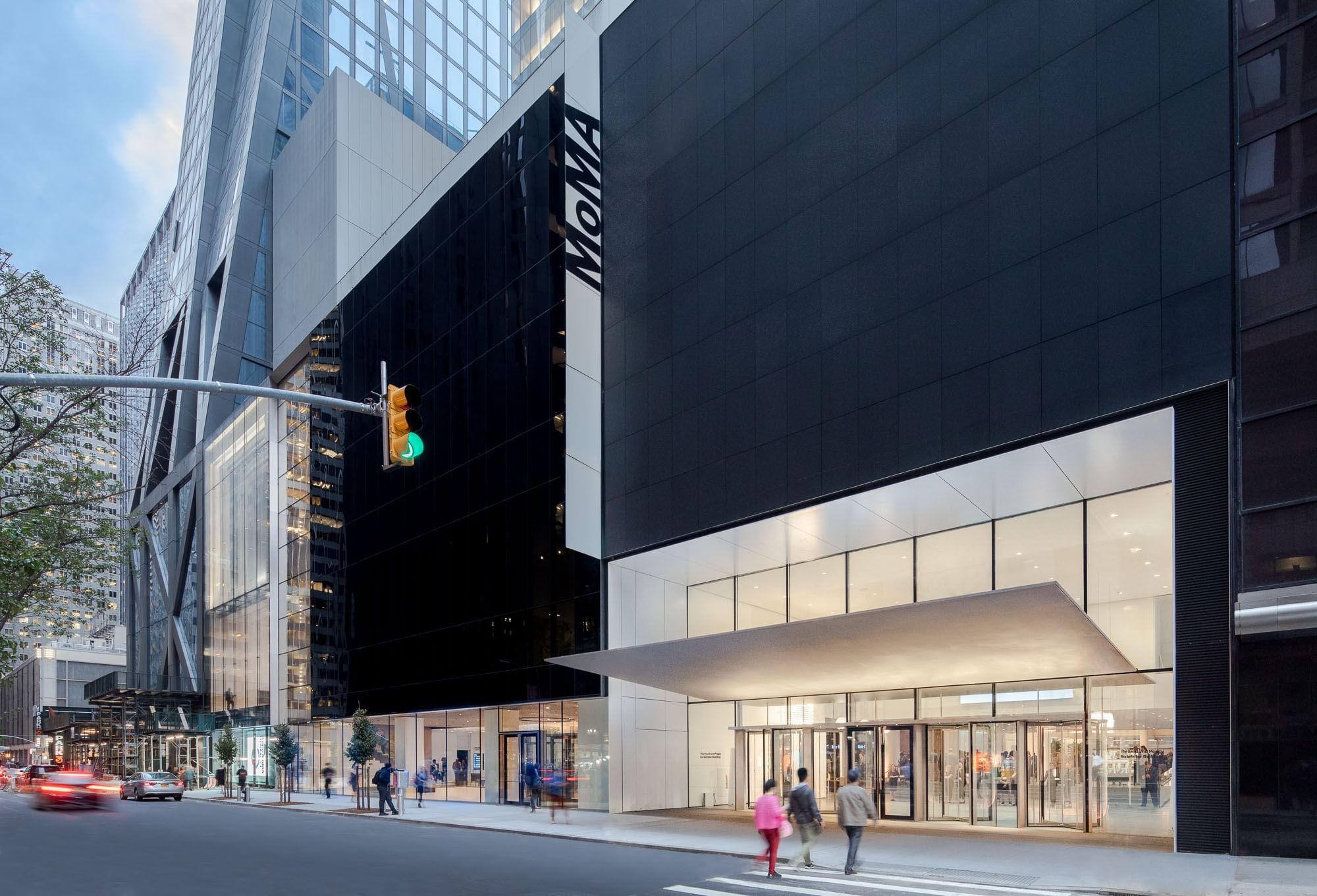 The modern glass and black facade of the MoMA museum entrance near Warwick New York