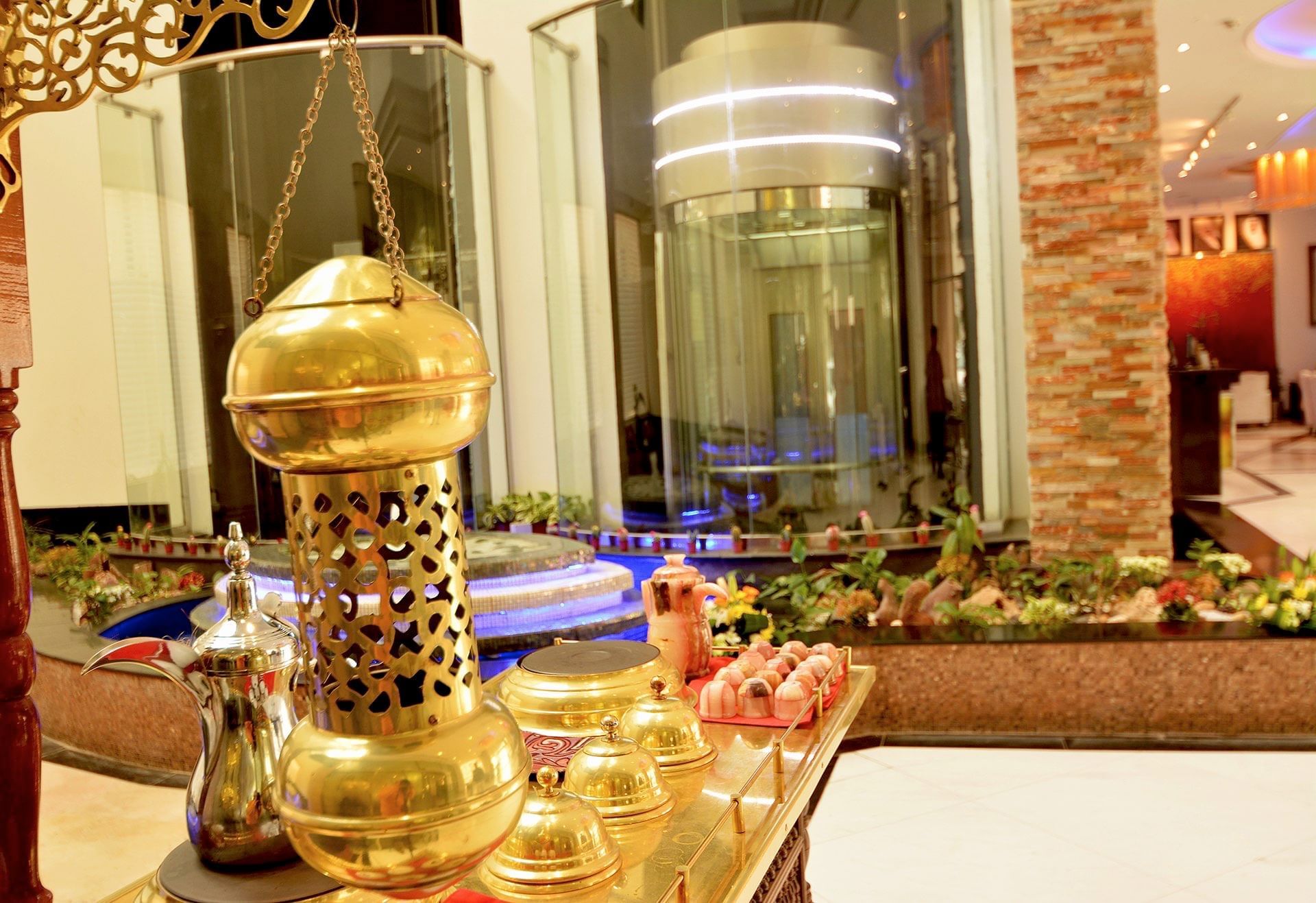 Close-up of the golden bell hanging in the lobby at Dabab Hotel by Warwick - Riyadh