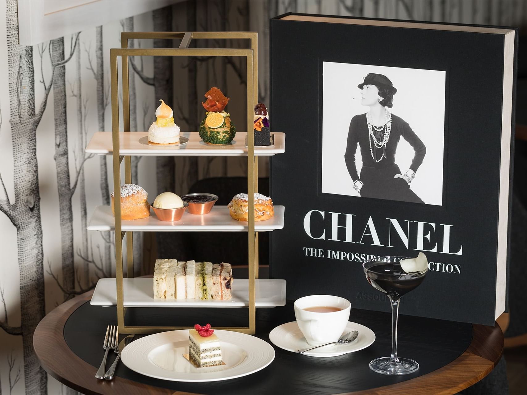delisious pastry and coffee next to a Chanel book, Edwardian Hotel Group
