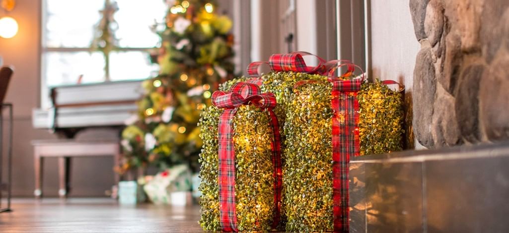 A warm lobby of a hotel in Canmore is decorated for Christmas.