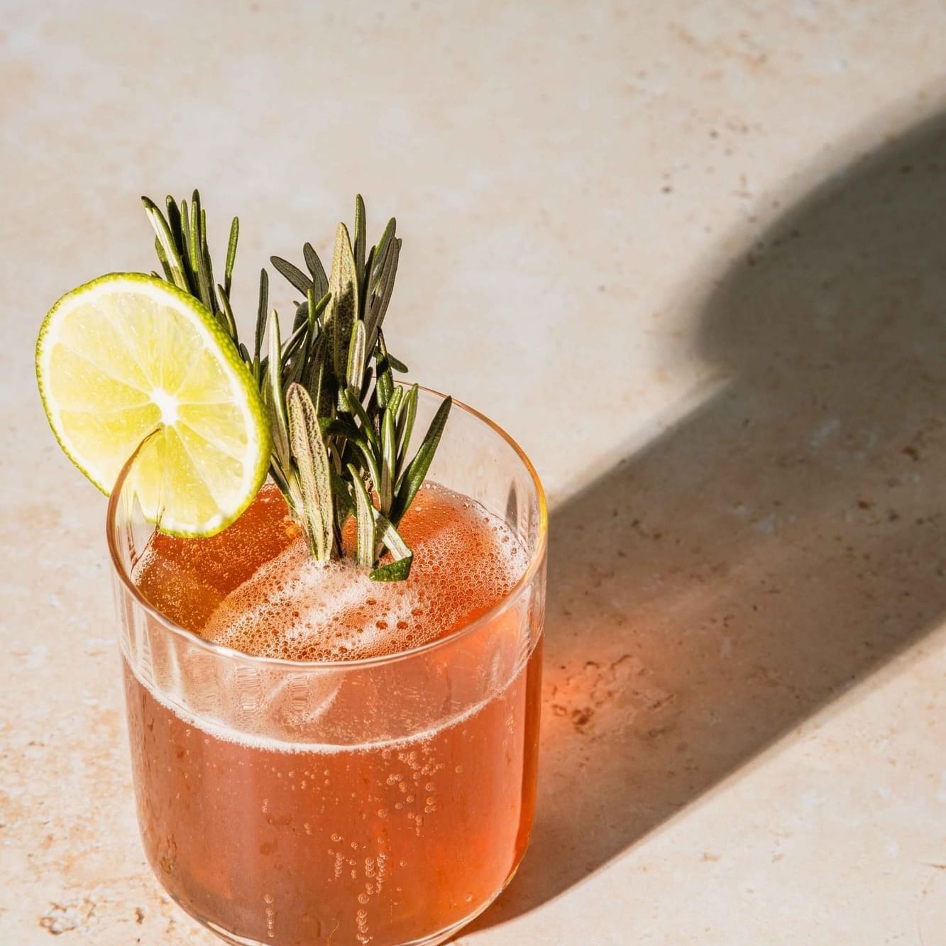 Cocktail with lime & rosemary served at The Artisan Hotel at Tuscan Village