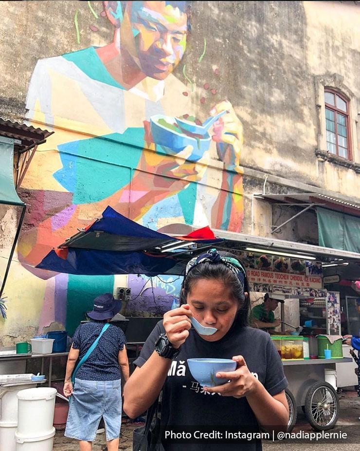 a female customer was enjoying her cendol in front of Penang Road Famous Teochew Chendull
