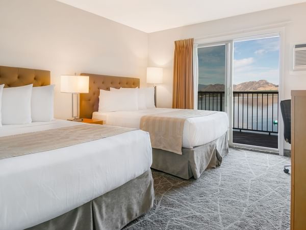 Two double beds with a balcony lake view