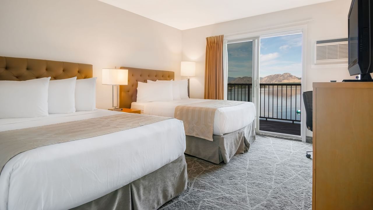 Two double beds with a balcony lake view