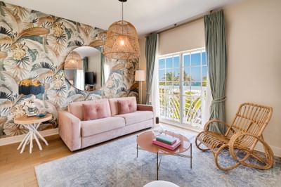 Lavish interior & decor of the living area in Junior King Oceanfront Suite with Balcony at The Savoy Hotel & Beach Club