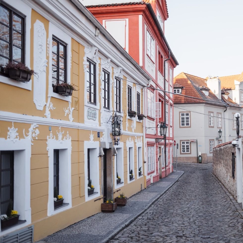 An alley between buildings in a town near Falkensteiner Hotels