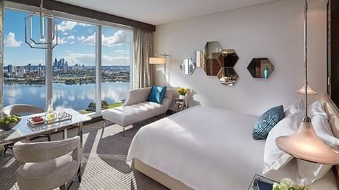 A comfy bed kingbed in a room at Crown Hotels