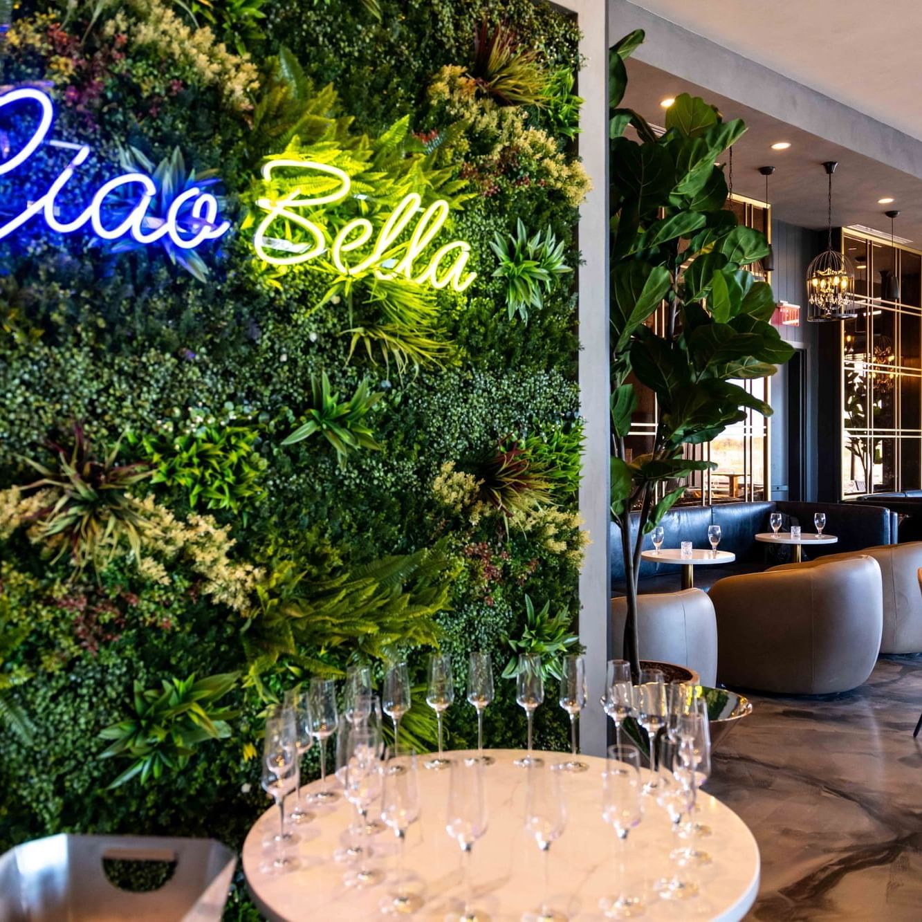 Wine glasses arranged on a table in the Bar at The Artisan Hotel at Tuscan Village