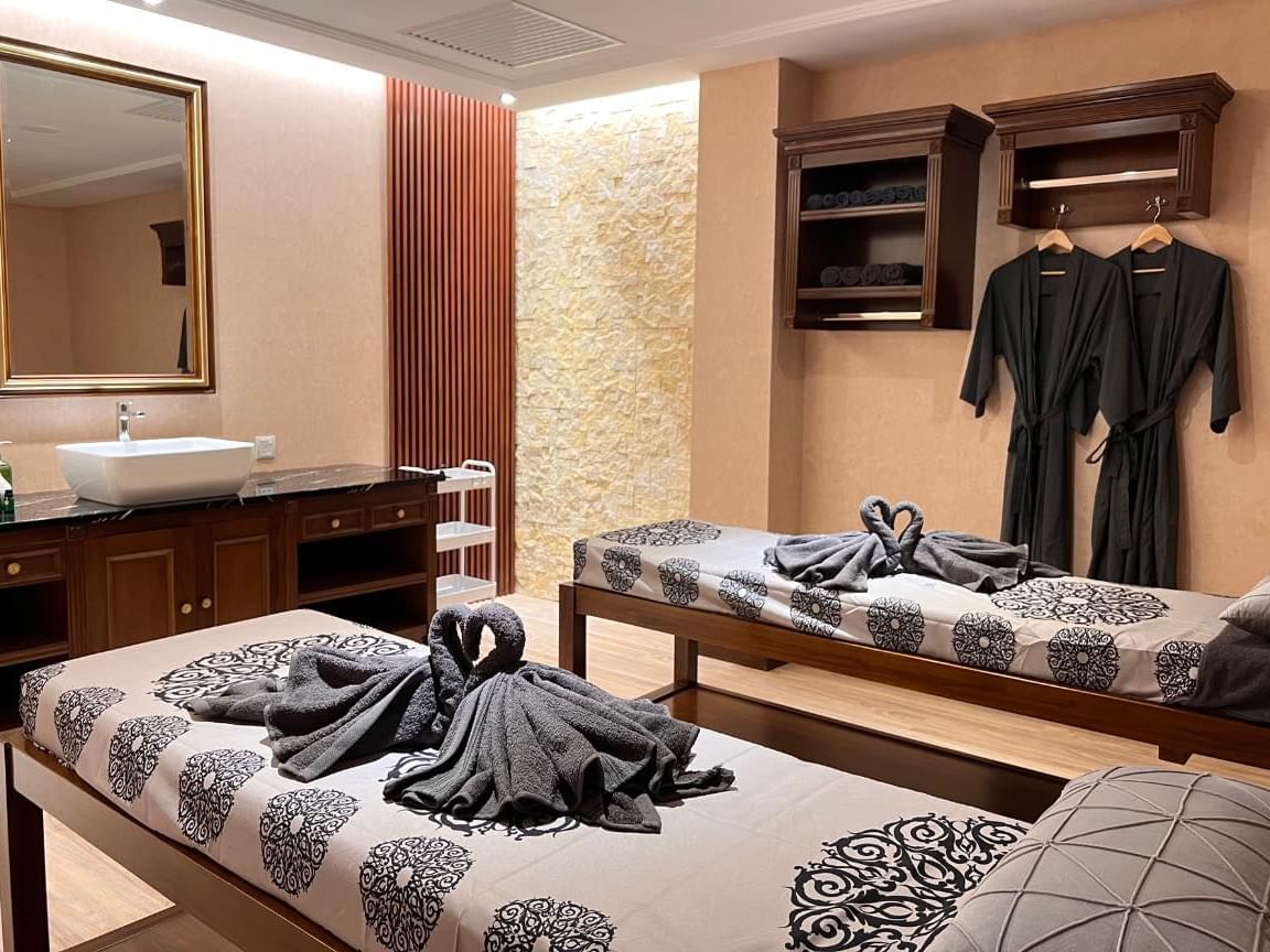 Treatment room with two spa beds at EDEN Damai Wellness near Hemisphere Corporation