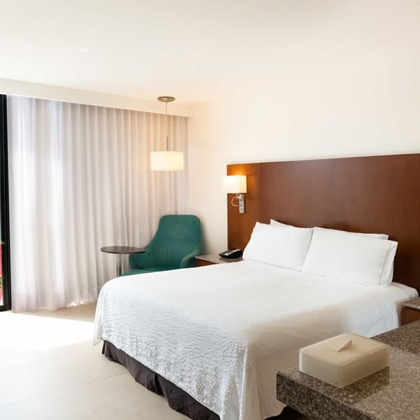 Work desk & bed in Superior Room 1-King at Fiesta Inn