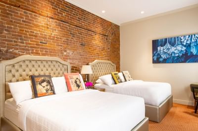 Interior of Double Queen Brownstone at Retro Suites Hotel