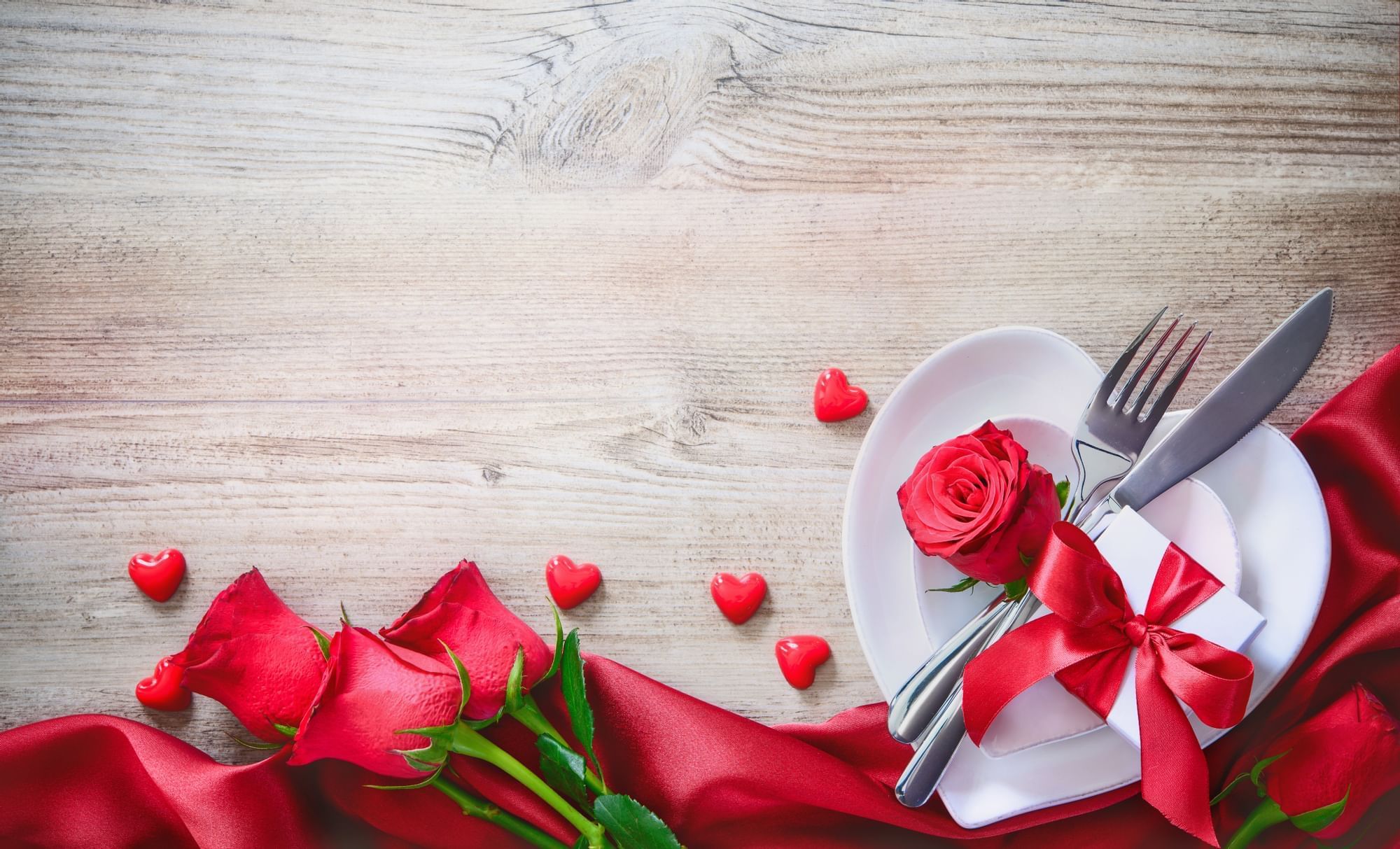 A poster of a Heart shaped plate & roses at Peabody Memphis