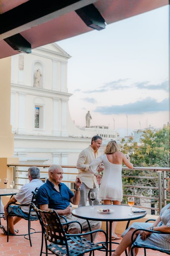 People enjoying the rooftop restaurant at Hotel El Convento