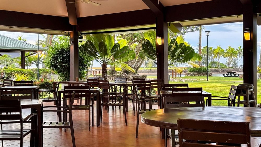 Empty tables and chairs inside Grill restaurant at The Naviti Resort in Korolevu.