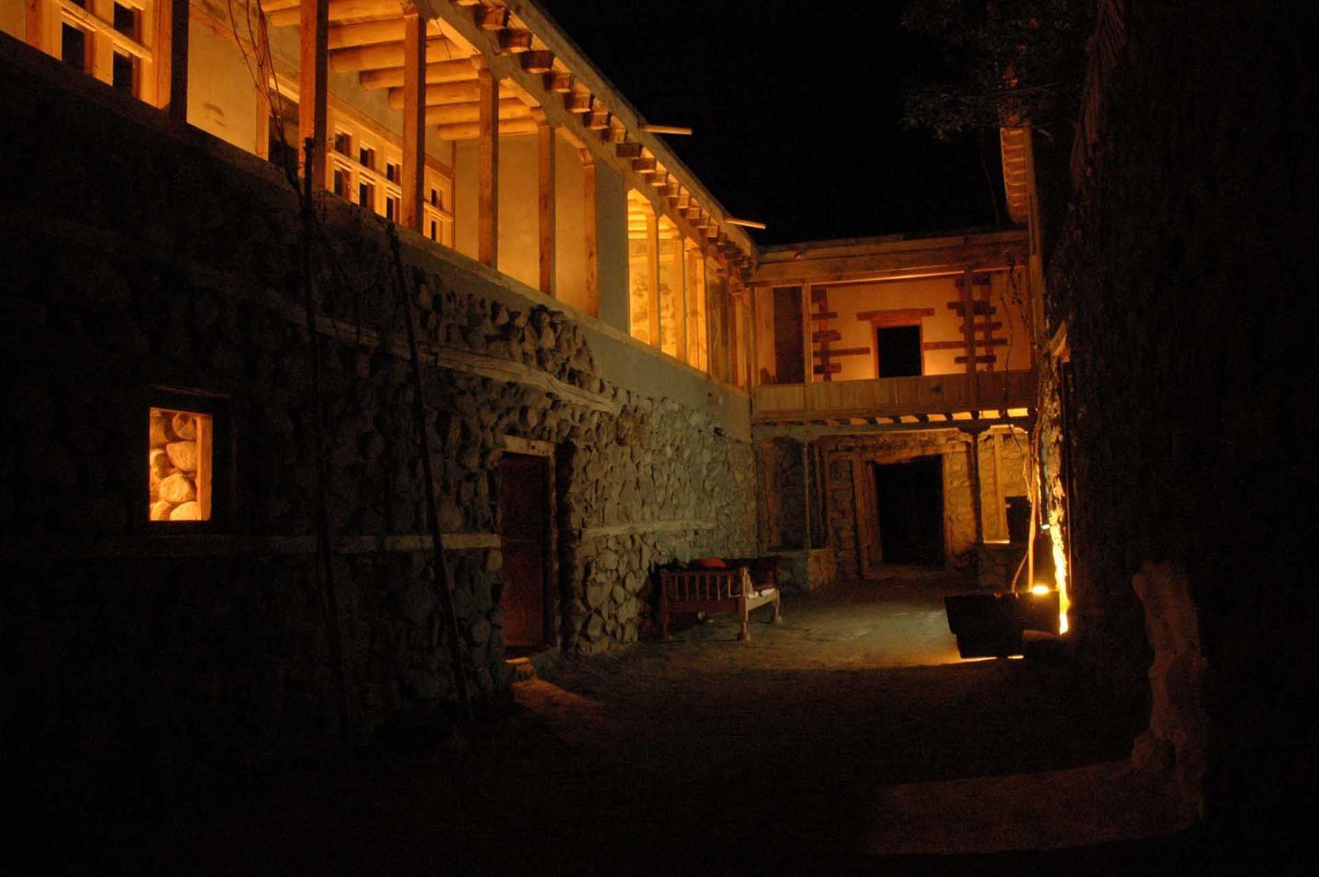 An exterior view of the hotel at night of Serena Khaplu Palace