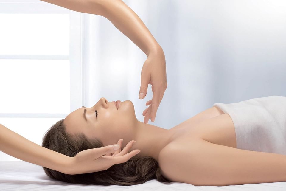 Lady enjoying a soothing neck and shoulder treatment at Thalgo Spa, The Saujana Hotel Kuala Lumpur