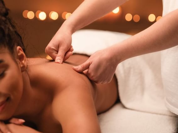A girl having back massage at Catskills Spa at Honor’s Haven