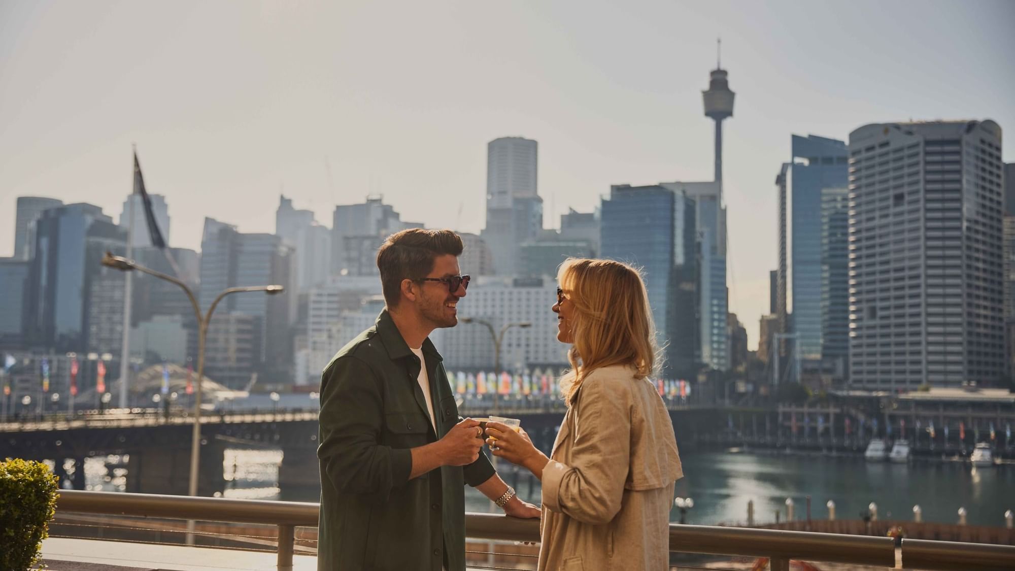 Couple enjoying sunset drinks on ibis bar deck
