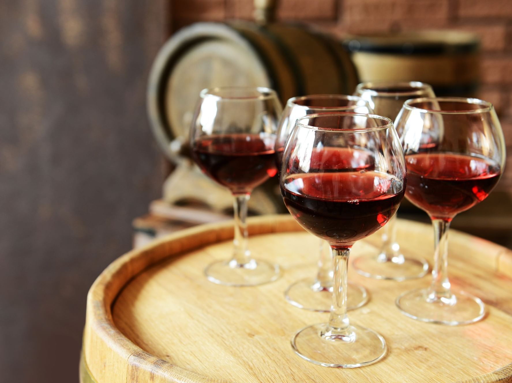 Glasses of red wine on a wooden barrel at Honor’s Haven