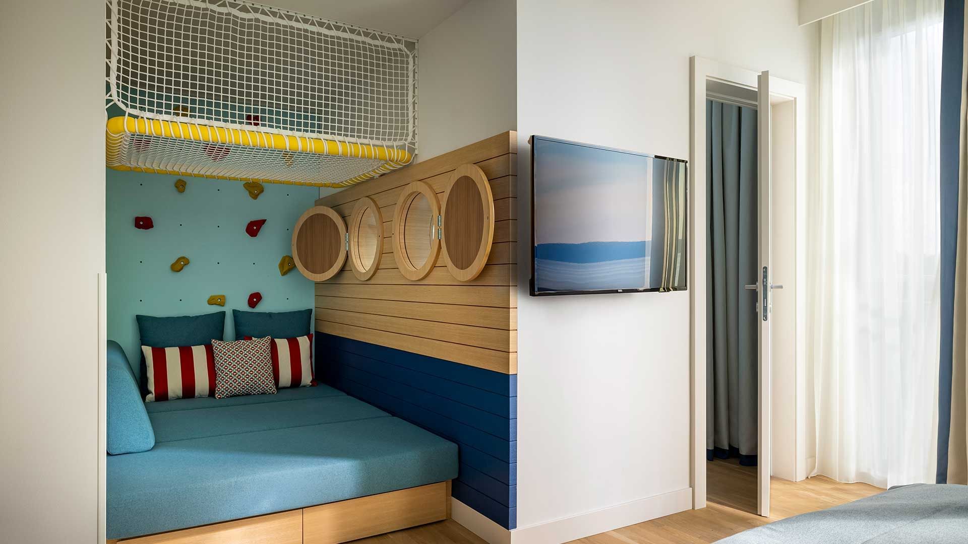 Bed in Family Room Superior Seaside at Falkensteiner Hotels