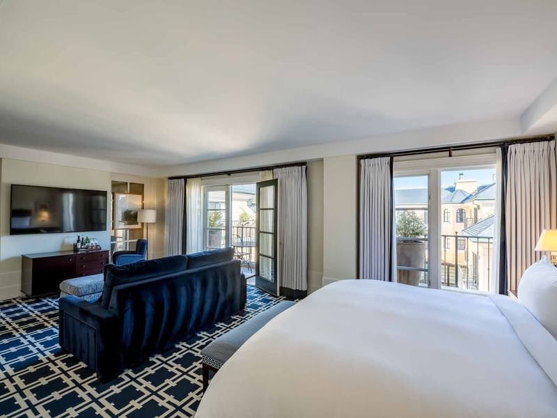 TV lounge area facing the bed in Courtyard Grand Executive Suite at El Prado Hotel