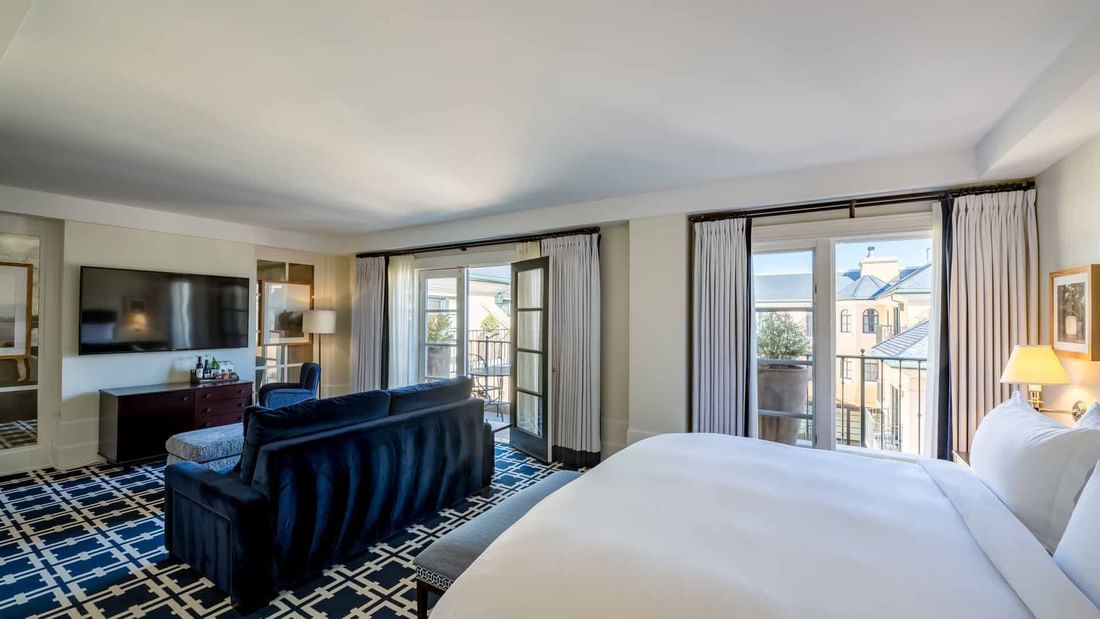 TV lounge area facing the bed in Courtyard Grand Executive Suite at El Prado Hotel