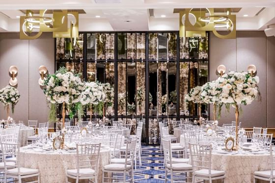 Floral decor banquet tables in Whiteley Ballroom at Amora Hotel