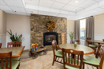 Fireplace by dining area of Complimentary Hot Breakfast Buffet at Boothill Inn & Suites