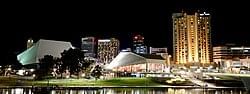 lit Festival Centre dome and city lights reflected on the river near Ibis Adelaide