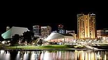 lit Festival Centre dome and city lights reflected on the river near Ibis Adelaide