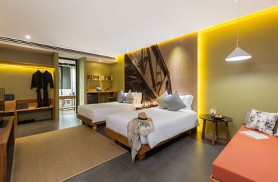 Well arranged three single beds in a room at U Hotels & Resorts