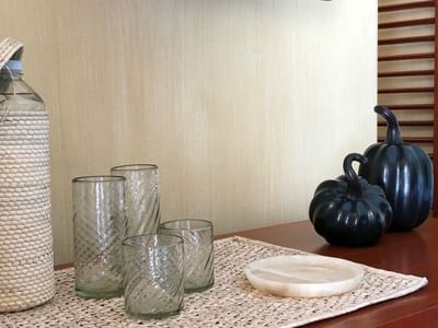 Bottle, glasses & ornaments at Cala de Mar