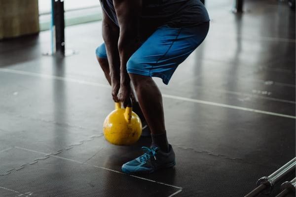 man performing a squat