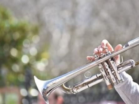 A man playing trumpet outside at La Galerie Hotel