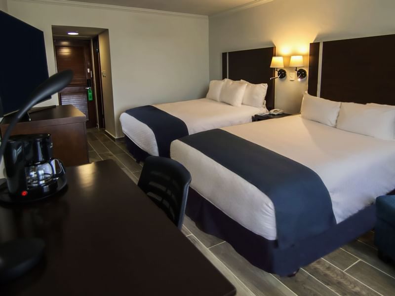 Two beds & work desk in Superior Double Room at Gamma Hotels
