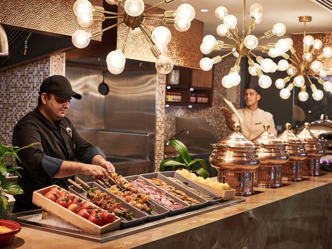 Chefs presenting dishes in The Stage Restaurant at Paramount Hotel Dubai