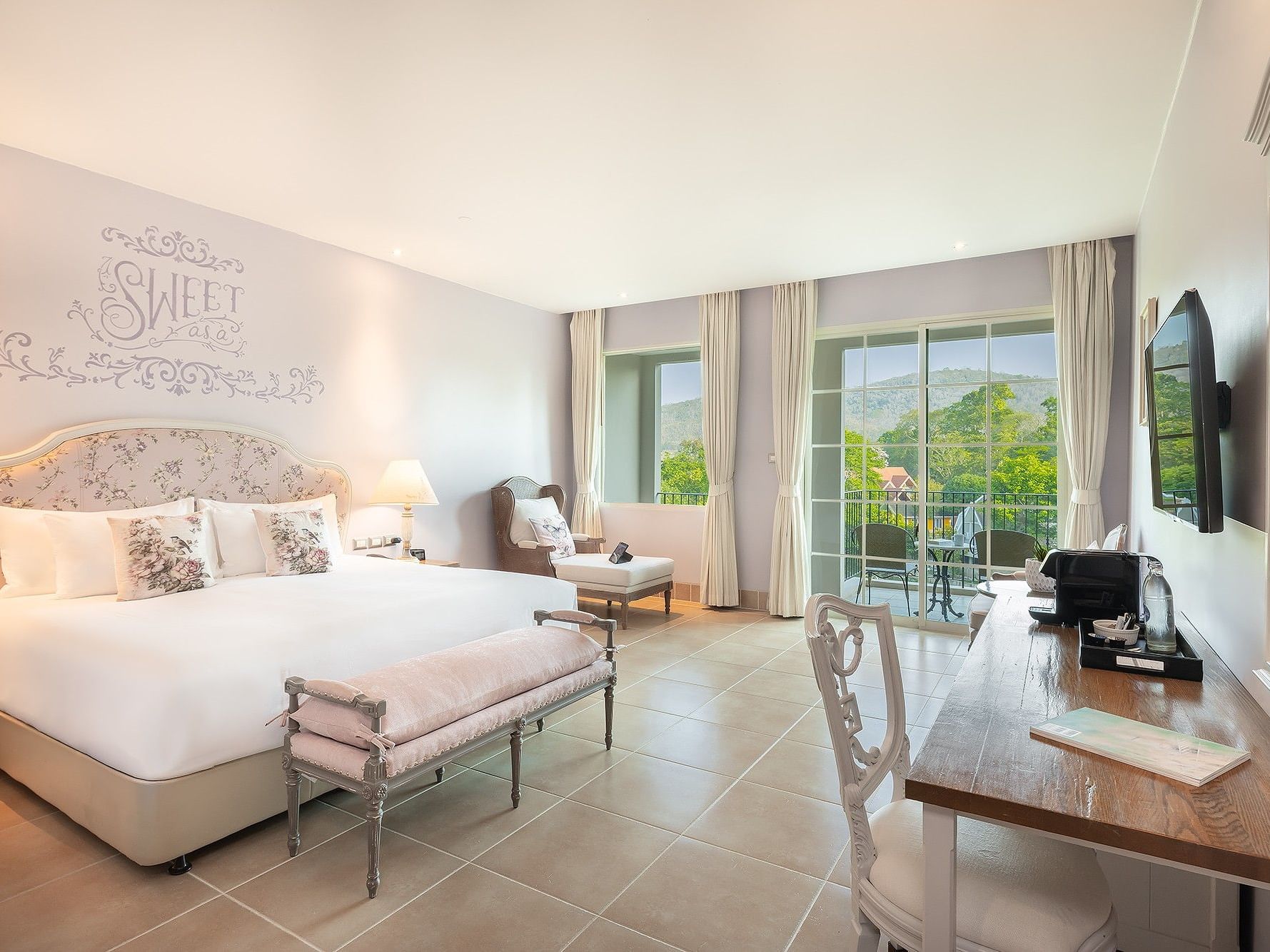 Deluxe Mountain View room at U Khao Yai with private balcony overlooking lush mountains