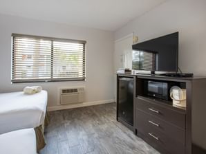 Twin beds with TV in Remodeled Guest Room at Legacy Vacation