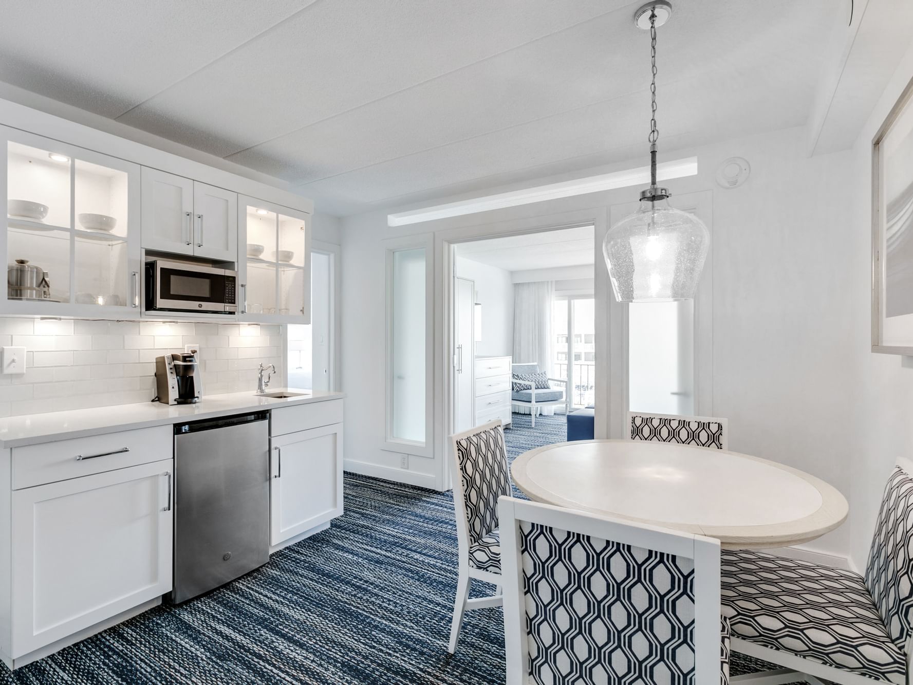 Signature 1 Bedroom 2 Bathroom Suite at ICONA Avalon with kitchenette, dining table, separate living room