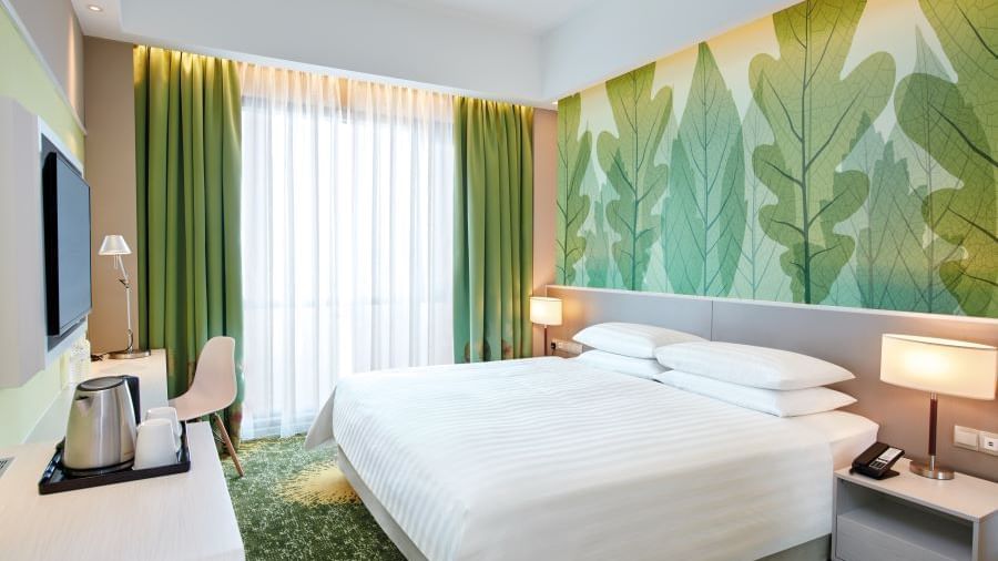 Comfy bed with side tables in a room at Sunway Velocity Hotel