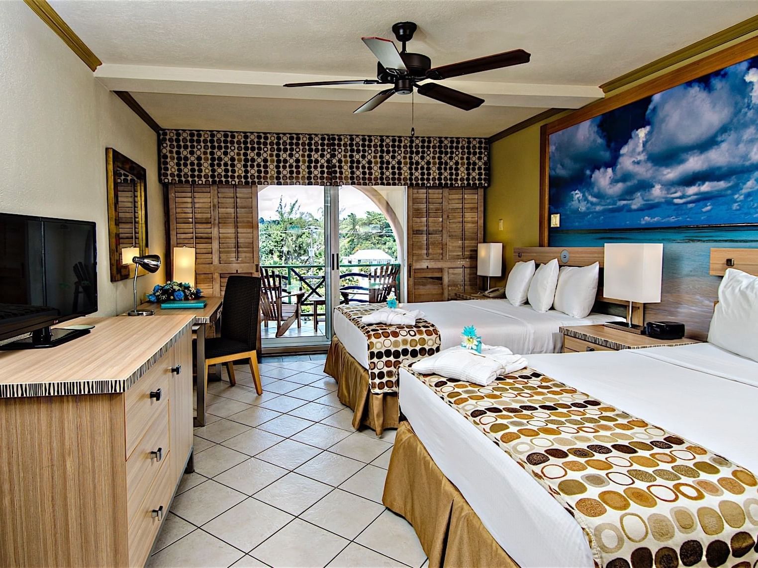 Interior of Island View Room with twin beds & a balcony at Accra Hotels & Resorts