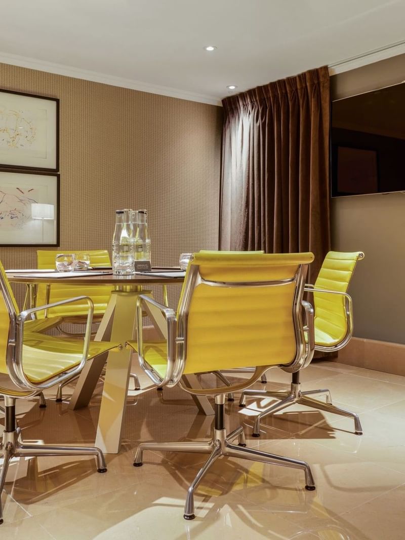 Private Suite with boardroom set up and unique artwork at The May Fair Hotel
