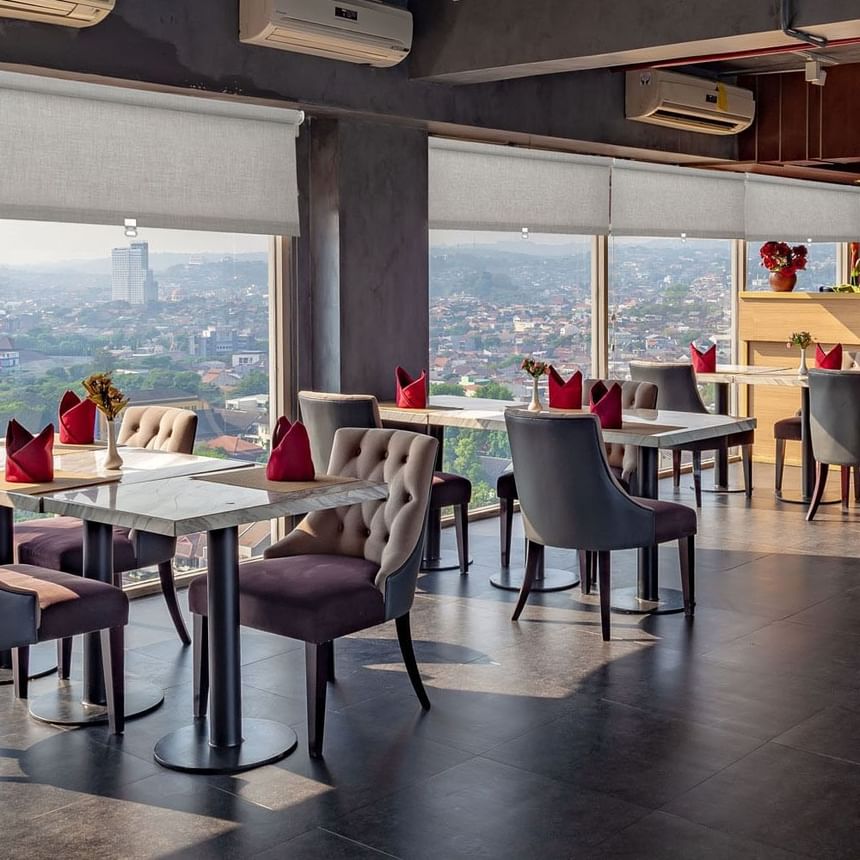 Dining table arrangements overlooking the city at LK Hospitality Group
