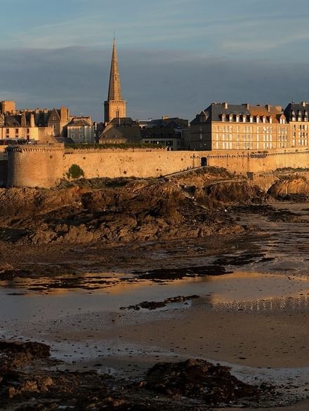 The historic walled city of Saint-Malo, featuring the Saint-Vincent Cathedral spire near Warwick Hotels & Resort