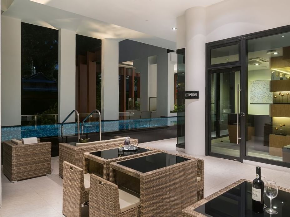 Pool area with dining area at Momentus Novena