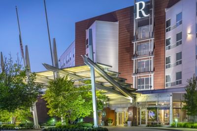 exterior of renaissance boston patriot place hotel at sunset