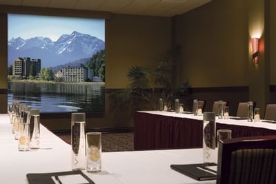 conference room with u shaped table and screen