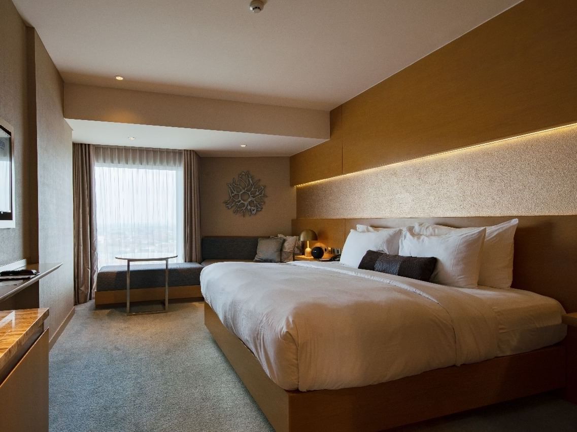 Comfy king bed in Premium room at Vasa Hotel Surabaya