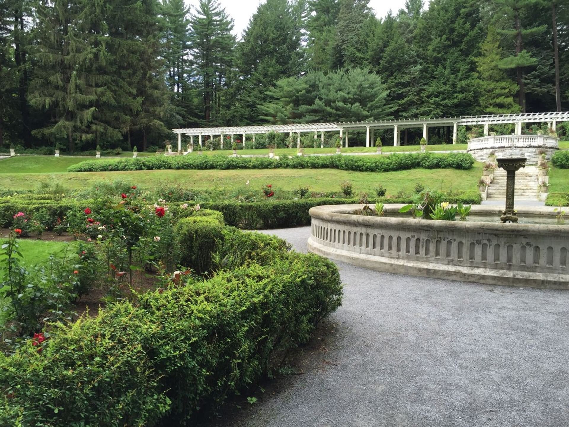 Fountain in Yaddo Gardens with flowers and bushes near Hotel Brookmere