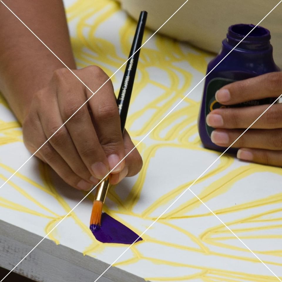 Closeup of a man painting a picture at Punta Islita Hotel